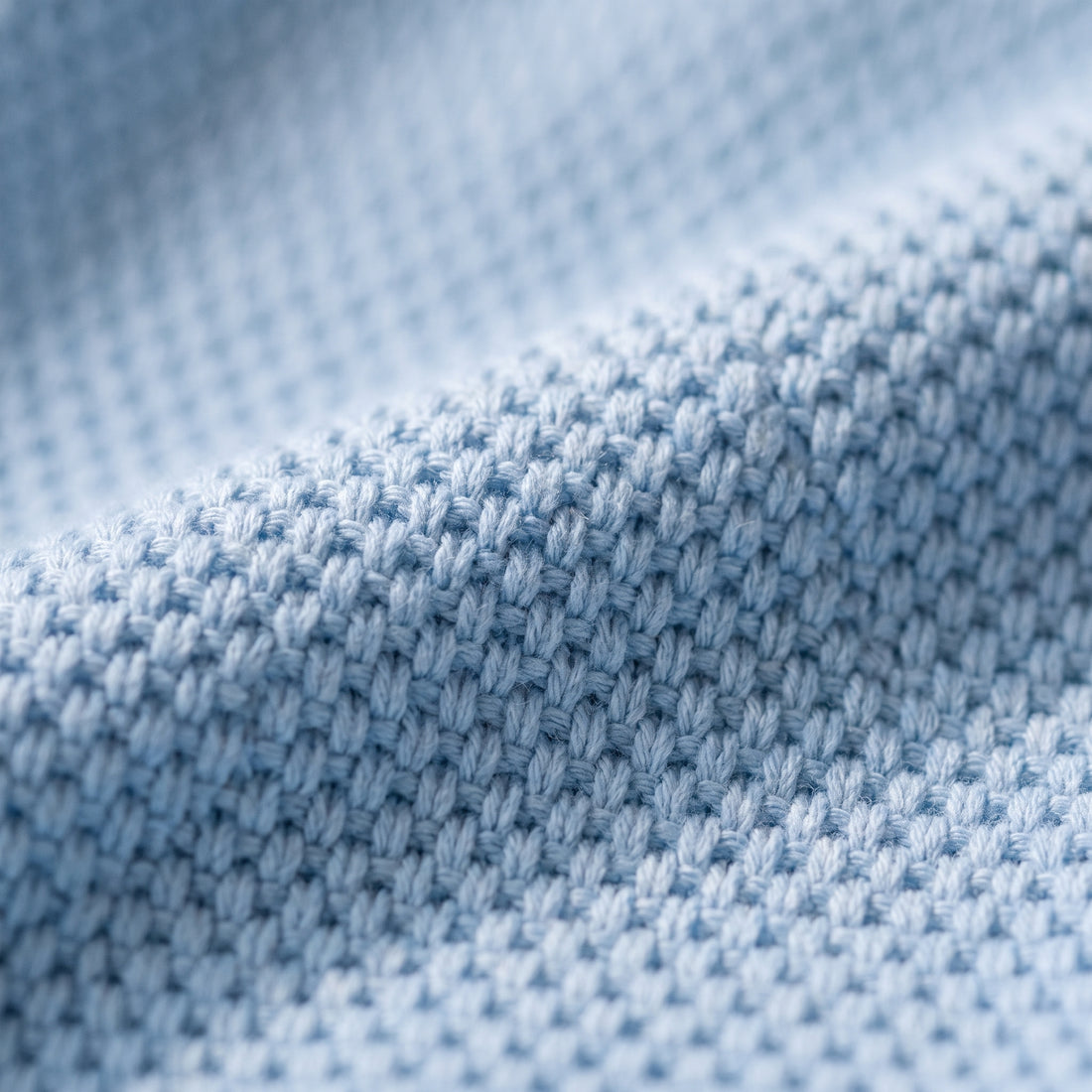 Close-up of the textured knit fabric of the polo and shorts set