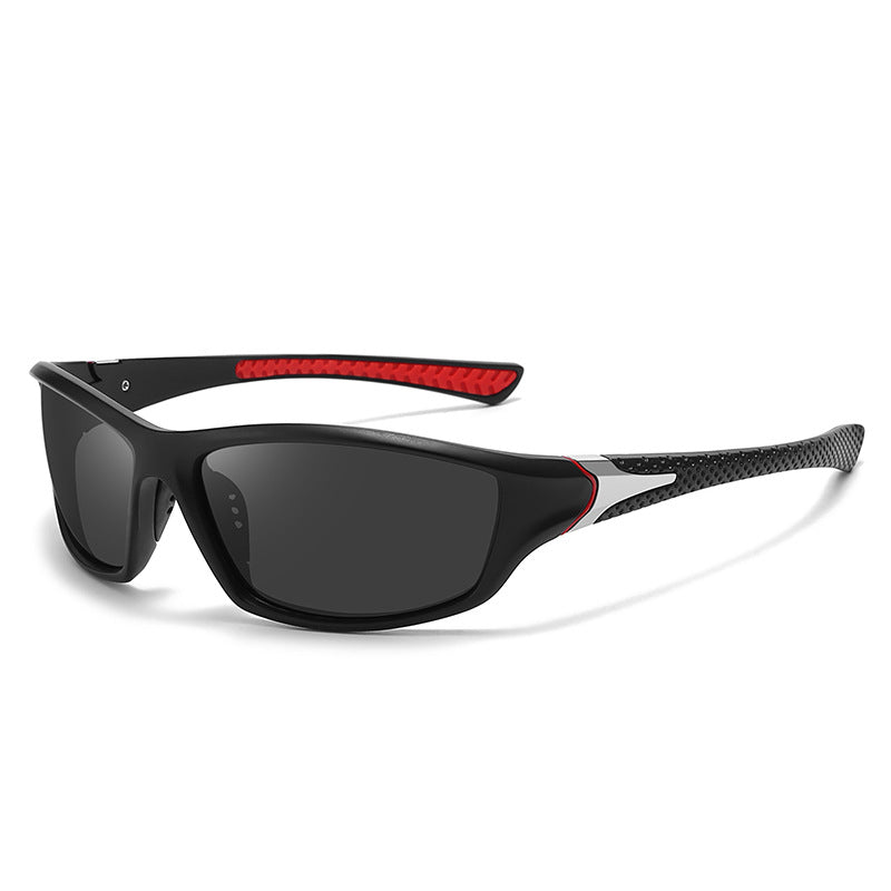 Black wraparound sports sunglasses with red trim and dark lenses, angled product view