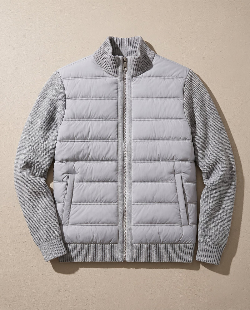 Bellardi Hybrid Puffer Jacket in Light Grey, laid flat and unzipped, showing the quilted front panel, knit sleeves and collar.