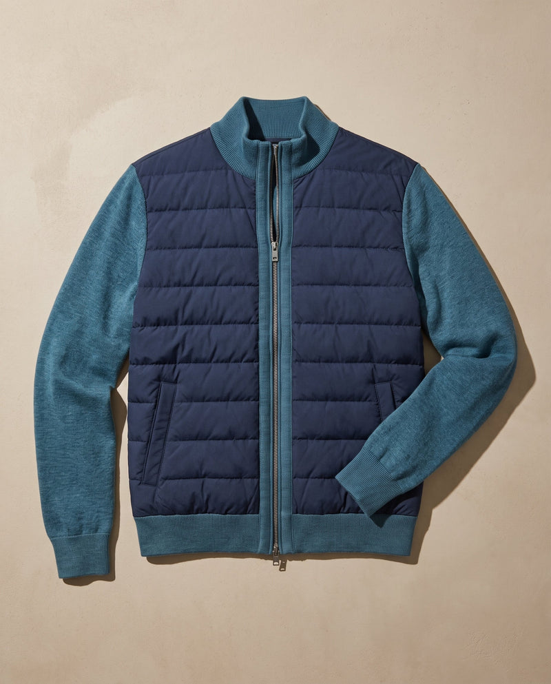 Bellardi Hybrid Puffer Jacket in Navy Blue, laid flat and unzipped, showing the dark navy quilted front panel and petrol-teal knit sleeves.