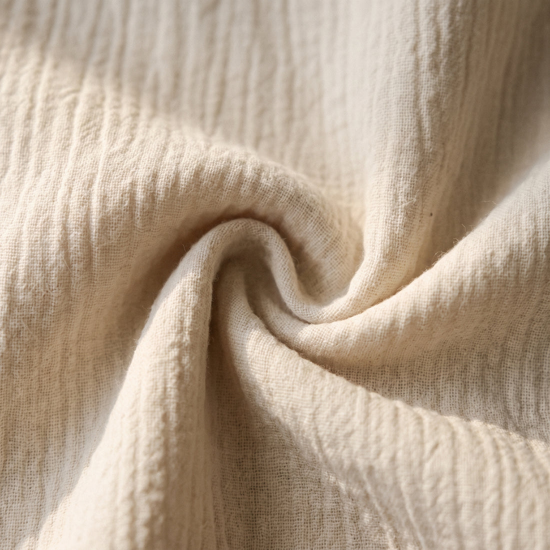 Close-up of off-white textured crinkle-weave fabric