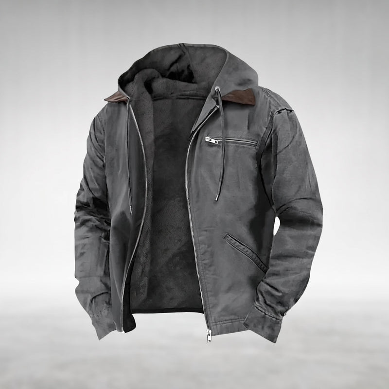 Gray Drake hooded jacket, shown open with the silver centre-front zip undone, fixed hood lined in dark plush fleece, dark-brown pointed contrast collar, two welt pockets on the right front panel, product shot on a plain grey background.