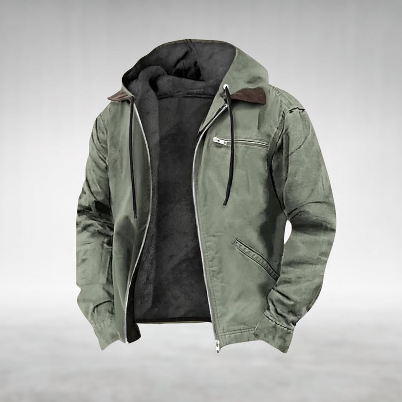 Green Drake hooded jacket, shown open with the silver centre-front zip undone, fixed hood lined in dark plush fleece, dark-brown pointed contrast collar, two welt pockets on the right front panel, product shot on a plain grey background.